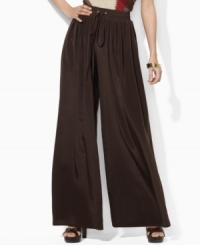 Lauren by Ralph Lauren's breezy wide-leg pant is crafted with a soft sueded crepe construction and finished with a comfortable smocked waistband for ease and style. Lauren by Ralph Lauren's breezy wide-leg pant is crafted with a soft sueded crepe construction and finished with a comfortable smocked waistband for ease and style.