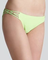 PilyQ turns up the brights with the Brie bikini, a standout in lime green with braided and beaded details. PilyQ turns up the brights with the Brie bikini, a standout in lime green with braided and beaded details.