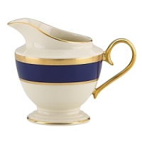 Inspired by privately commissioned presidential dinnerware, this fine china features stately navy bands and a gold border etched with patriotic stars. Inspired by privately commissioned presidential dinnerware, this fine china features stately navy bands and a gold border etched with patriotic stars.