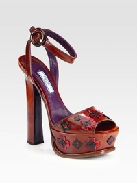 A flower appliqué defines this platform leather silhouette with an adjustable ankle strap. Self-covered heel, 6 (150mm)Covered platform, 1¾ (45mm)Compares to a 4¼ heel (110mm)Leather upperAdjustable ankle strapLeather liningLeather and rubber solePadded insoleMade in Italy A flower appliqué defines this platform leather silhouette with an adjustable ankle strap. Self-covered heel, 6 (150mm)Covered platform, 1¾ (45mm)Compares to a 4¼ heel (110mm)Leather upperAdjustable ankle strapLeather liningLeather and rubber solePadded insoleMade in Italy