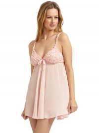 THE LOOKV necklineRuffled front with center bow detailAdjustable spaghetti straps with ruffled trimPullover styleElastic ruching across backTHE FITAbout 29½ from shoulder to hemTHE MATERIALPolyesterCARE & ORIGINMachine washImported THE LOOKV necklineRuffled front with center bow detailAdjustable spaghetti straps with ruffled trimPullover styleElastic ruching across backTHE FITAbout 29½ from shoulder to hemTHE MATERIALPolyesterCARE & ORIGINMachine washImported