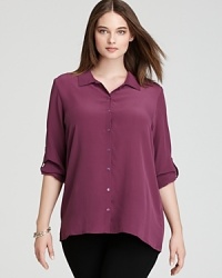 Glimmering accents shine against a silk Eileen Fisher Plus blouse for a luxe take on utilitarian chic. Glimmering accents shine against a silk Eileen Fisher Plus blouse for a luxe take on utilitarian chic.