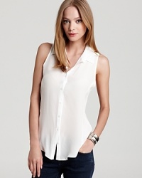 A great alternative to the simple white t-shirt, this Aqua blouse is just as comfortable with a fashion-forward twist. For an occasional casual-cool accent, tie the front at the hem. A great alternative to the simple white t-shirt, this Aqua blouse is just as comfortable with a fashion-forward twist. For an occasional casual-cool accent, tie the front at the hem.
