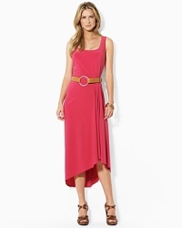 Infused with romantic movement, a sleek tank dress is crafted with subtle pleating at the waist that creates a fluid draped hemline. Infused with romantic movement, a sleek tank dress is crafted with subtle pleating at the waist that creates a fluid draped hemline.