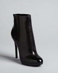 Ladylike perfection: these cap toe booties balance retro and modern aesthetics in a memorable silhouette: by B Brian Atwood. Ladylike perfection: these cap toe booties balance retro and modern aesthetics in a memorable silhouette: by B Brian Atwood.