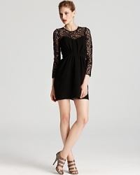 Shoshanna dresses up the LBD in delicate lace, showcasing sheer sleeves and a bustier-inspired lining. Shoshanna dresses up the LBD in delicate lace, showcasing sheer sleeves and a bustier-inspired lining.