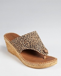Take a walk on the wild side with Andre Assous' leopard printed Alyssa wedge--this thong toe, espadrille silhouette is easy to slip on and go. Take a walk on the wild side with Andre Assous' leopard printed Alyssa wedge--this thong toe, espadrille silhouette is easy to slip on and go.