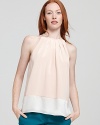 A neutral touch of serene color blocked flair enriches this wispy silk Theory top.