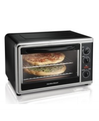 Compliments to this countertop chef, a space-saving design that fits entire meals, two 12 pizzas, casseroles, two cake pans or many other delightful dishes, and prepares them to perfection with bake, broil, rotisserie and convection settings. An easy clean interior comes stocked with 2 cooking racks, 2 baking pans, a broiler rack and rotisserie accessories. 1-year warranty. Model 31100. Compliments to this countertop chef, a space-saving design that fits entire meals, two 12 pizzas, casseroles, two cake pans or many other delightful dishes, and prepares them to perfection with bake, broil, rotisserie and convection settings. An easy clean interior comes stocked with 2 cooking racks, 2 baking pans, a broiler rack and rotisserie accessories. 1-year warranty. Model 31100.