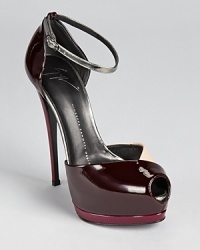 A towering heel gives way to a color blocked silhouette in slick patent leather. From Giuseppe Zanotti. A towering heel gives way to a color blocked silhouette in slick patent leather. From Giuseppe Zanotti.