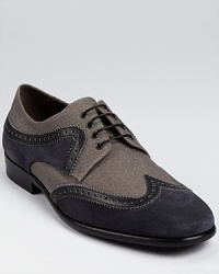 Classic craftsmanship meets time-honored tradition in these well-appointed wing-tip shoes from Salvatore Ferragamo. Classic craftsmanship meets time-honored tradition in these well-appointed wing-tip shoes from Salvatore Ferragamo.