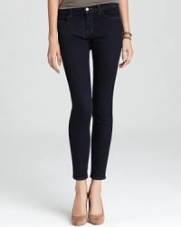 Mid rise J Brand jeans with a skinny-fit silhouette in dark wash denim for an irresistibly chic urban look. Mid rise J Brand jeans with a skinny-fit silhouette in dark wash denim for an irresistibly chic urban look.
