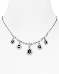 As if taken from a socialite's jewel box, this ornate drop necklace from Carolee flaunts an heirloom quality cast in rhodium plated metal with delicate dangling crystal stations. As if taken from a socialite's jewel box, this ornate drop necklace from Carolee flaunts an heirloom quality cast in rhodium plated metal with delicate dangling crystal stations.