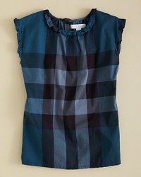 Burberry's sleeveless blouse updates a classic look with ruffle trim and bow accents. Burberry's sleeveless blouse updates a classic look with ruffle trim and bow accents.