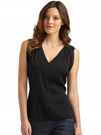 THE LOOKHalter-look angled bands ease into back foldover collarDeep V-necklineShort cap sleeves with soft shoulder pleatsLoose fittingTHE FITAbout 23 from shoulder to hemTHE MATERIAL95% silk/5% elastaneCARE & ORIGINDry cleanImportedModel shown is 5'10 (177cm) wearing US size Small. THE LOOKHalter-look angled bands ease into back foldover collarDeep V-necklineShort cap sleeves with soft shoulder pleatsLoose fittingTHE FITAbout 23 from shoulder to hemTHE MATERIAL95% silk/5% elastaneCARE & ORIGINDry cleanImportedModel shown is 5'10 (177cm) wearing US size Small.