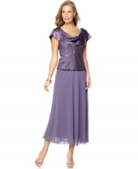 Patra's dress defines evening elegance with a shimmering cowlneck, sparkling beaded bodice and sweeping chiffon shirt. Patra's dress defines evening elegance with a shimmering cowlneck, sparkling beaded bodice and sweeping chiffon shirt.