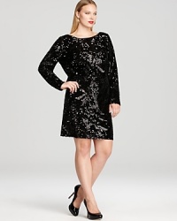 Jet black sequins lend understated sparkle on Aidan Mattox's long sleeve dress--showing off a tonal floral pattern detailed in velvet, this standout dress shimmers in the spotlight.