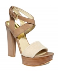 Style that takes your fashion straight up! MICHAEL Michael Kors' Nadina platform sandals have a strappy criss-cross ankle buckle and contrasting front strap. Style that takes your fashion straight up! MICHAEL Michael Kors' Nadina platform sandals have a strappy criss-cross ankle buckle and contrasting front strap.