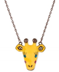 Lengthen your neck with this cute giraffe pendant necklace from Betsey Johnson. Hanging from a bronze tone chain, the pendant is embellished with crystal accents and brown details. Crafted in antiqued gold tone mixed metal. Approximate length: 16 inches + 3-inch extender. Approximate drop: 1-3/4 inches. Lengthen your neck with this cute giraffe pendant necklace from Betsey Johnson. Hanging from a bronze tone chain, the pendant is embellished with crystal accents and brown details. Crafted in antiqued gold tone mixed metal. Approximate length: 16 inches + 3-inch extender. Approximate drop: 1-3/4 inches.