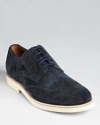A relaxed but refined wingtip oxford rendered in soft suede. A relaxed but refined wingtip oxford rendered in soft suede.