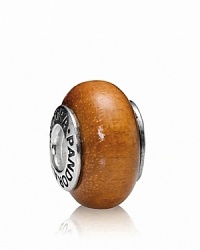 With its warm tawny tones, Muiracatiara wood makes for a stunning charm. Logo-engraved sterling silver trim displays the PANDORA signature. With its warm tawny tones, Muiracatiara wood makes for a stunning charm. Logo-engraved sterling silver trim displays the PANDORA signature.