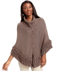 Ponchos are one of this season's hottest style trends! Style&co.'s comfy knit design features a warm funnel-neck and a fun fringe hem. Ponchos are one of this season's hottest style trends! Style&co.'s comfy knit design features a warm funnel-neck and a fun fringe hem.
