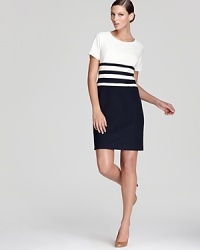 Punctuated stripes lend a timeless look to this Anne Klein dress, rendered in an effortless t-shirt silhouette. Punctuated stripes lend a timeless look to this Anne Klein dress, rendered in an effortless t-shirt silhouette.