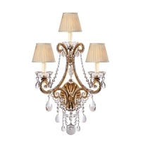 The curved arms, cascading crystals and candle flame-shaped bulbs on this Ralph Lauren sconce will illuminate your decor with unparalleled glamour. The curved arms, cascading crystals and candle flame-shaped bulbs on this Ralph Lauren sconce will illuminate your decor with unparalleled glamour.