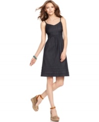 This ultra-chic denim dress from Calvin Klein Jeans features a flattering fitted bodice and an empire waist. Rendered in the darkest denim, it's a stylish essential season after season! This ultra-chic denim dress from Calvin Klein Jeans features a flattering fitted bodice and an empire waist. Rendered in the darkest denim, it's a stylish essential season after season!