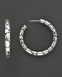 From the Kali collection, medium hoop earrings with the molten lava motif, designed by John Hardy. From the Kali collection, medium hoop earrings with the molten lava motif, designed by John Hardy.
