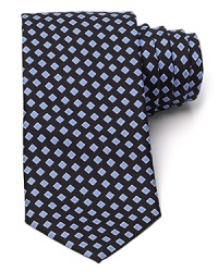 BOSS Black's classic silk tie is both modern and timeless in a geometric square print. BOSS Black's classic silk tie is both modern and timeless in a geometric square print.