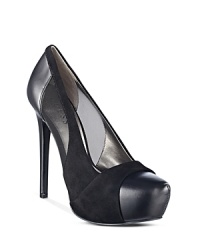 Upgrade your basic black pumps to a vampy, platform style with subtle mesh cutouts. By GUESS.