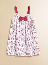 A little ladylike frock with a cheery floral print, empire waist and bow at the neckline. ScoopneckSleevelessPullover styleCottonMachine washImported A little ladylike frock with a cheery floral print, empire waist and bow at the neckline. ScoopneckSleevelessPullover styleCottonMachine washImported