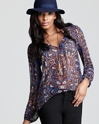 Aqua's breezy blouse in a pretty paisley print brings statement style to your off-duty looks. Aqua's breezy blouse in a pretty paisley print brings statement style to your off-duty looks.
