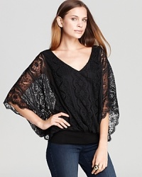 Sheer lace sleeves make a dramatic appearance on this Chelsea & Theodore blouse for a decidedly romantic look. Slip the style into a red pencil skirt and captivate at cocktail hour. Sheer lace sleeves make a dramatic appearance on this Chelsea & Theodore blouse for a decidedly romantic look. Slip the style into a red pencil skirt and captivate at cocktail hour.