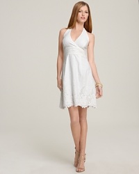 Exude the refreshing charm of Lilly Pulitzer in this eyelet detailed halter dress. Pair with minimal jewelry and simple heels for a party-perfect finish. Exude the refreshing charm of Lilly Pulitzer in this eyelet detailed halter dress. Pair with minimal jewelry and simple heels for a party-perfect finish.