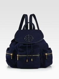A lightweight nylon style with luxurious leather trim and radiant hardware.Leather top handle, 3½ dropAdjustable shoulder straps, 12-18½ dropMagnetic snap flap closure with drawstringProtective metal feetThree outside zip pocketsOne inside zip pocketTwo inside open pocketsCotton lining12W X 13½H X 5½DImported A lightweight nylon style with luxurious leather trim and radiant hardware.Leather top handle, 3½ dropAdjustable shoulder straps, 12-18½ dropMagnetic snap flap closure with drawstringProtective metal feetThree outside zip pocketsOne inside zip pocketTwo inside open pocketsCotton lining12W X 13½H X 5½DImported