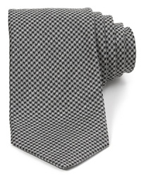 A vintage-inspired mini-check pattern gets the modern treatment with a dapper skinny-tie silhouette. A vintage-inspired mini-check pattern gets the modern treatment with a dapper skinny-tie silhouette.
