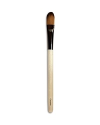 A small, flat brush designed for the precise application and blending of concealer. Made of synthetic materials.