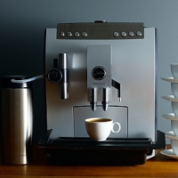 One-touch cappuccino/latte macchiato machine. Brew any size cappuccino or latte macchiato without moving the cup. Eight one-touch beverage buttons (from left to right: Milk, Latte Macchiato, Cappuccino, Special Coffee, Hot Water, Ristretto, Espresso, Coffee). Height and width adjustable coffee spout to accommodate large and small cups. All buttons individually programmable: Five coffee strengths, three coffee temperatures, cup sizes from .5 to 16 oz. milk processing from 3 to 120 seconds. Integrated commercial solid steel conical burr grinder: 6 fineness settings for any type bean. One-touch cappuccino/latte macchiato machine. Brew any size cappuccino or latte macchiato without moving the cup. Eight one-touch beverage buttons (from left to right: Milk, Latte Macchiato, Cappuccino, Special Coffee, Hot Water, Ristretto, Espresso, Coffee). Height and width adjustable coffee spout to accommodate large and small cups. All buttons individually programmable: Five coffee strengths, three coffee temperatures, cup sizes from .5 to 16 oz. milk processing from 3 to 120 seconds. Integrated commercial solid steel conical burr grinder: 6 fineness settings for any type bean.