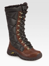 A classic shearling-lined staple in leather and durable nylon, finished with a rubber sole for extra traction. Shaft, 11½Leg circumference, 16½Quilted nylon and leather upperShearling liningRubber trek solePadded insoleImported A classic shearling-lined staple in leather and durable nylon, finished with a rubber sole for extra traction. Shaft, 11½Leg circumference, 16½Quilted nylon and leather upperShearling liningRubber trek solePadded insoleImported