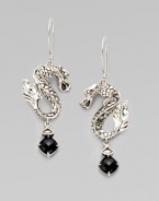 From the Naga Collection. Slightly ferocious but oh so stylish, these S-shaped dragons hold faceted drops of black chalcedony.Black chalcedonySterling silverDrop, about 2¼Ear wireImported