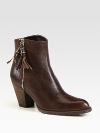 Twin tassels adds flair to this western-inspired leather silhouette, with a stacked heel and exposed zipper. Stacked heel, 3 (75mm)Leather upperSide zipLeather liningRubber solePadded insoleImported Twin tassels adds flair to this western-inspired leather silhouette, with a stacked heel and exposed zipper. Stacked heel, 3 (75mm)Leather upperSide zipLeather liningRubber solePadded insoleImported