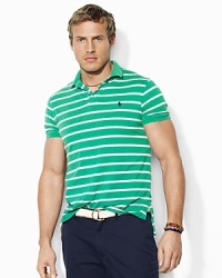 Softly faded and abraded for a well-worn look and feel, a trim-fitting polo shirt is designed in soft cotton jersey with an always-classic horizontal stripe. Softly faded and abraded for a well-worn look and feel, a trim-fitting polo shirt is designed in soft cotton jersey with an always-classic horizontal stripe.