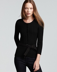 A dark style goes demure as a dainty bow-tie waist crafts a feminine Burberry Brit wool cardigan. A dark style goes demure as a dainty bow-tie waist crafts a feminine Burberry Brit wool cardigan.