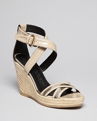 Burberry adds the perfect level of dash to neutral, wear-everywhere-with-everything espadrille wedges, with a whisper of smoked check plaid against leg-lengthening nude patent. Burberry adds the perfect level of dash to neutral, wear-everywhere-with-everything espadrille wedges, with a whisper of smoked check plaid against leg-lengthening nude patent.