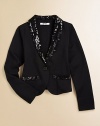 A classic blazer gets a fun twist with stylish sequin details. Sequin lapelFront button closureLong sleevesSequin mock pocketsCotton/polyester/spandexMachine washImported