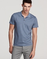 This versatile, plush cotton polo features an allover stripe pattern for an extra dimension to your casual cool wardrobe. This versatile, plush cotton polo features an allover stripe pattern for an extra dimension to your casual cool wardrobe.