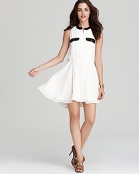 Rock a contrast cool look in this Aqua dress. The crisp white color is fashionably interrupted by the black neckline and pocket trim. Rock a contrast cool look in this Aqua dress. The crisp white color is fashionably interrupted by the black neckline and pocket trim.