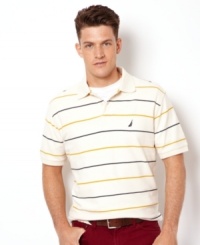 Clean and classic, this polo shirt from Nautica bridges the gap between casual and preppy style. Clean and classic, this polo shirt from Nautica bridges the gap between casual and preppy style.